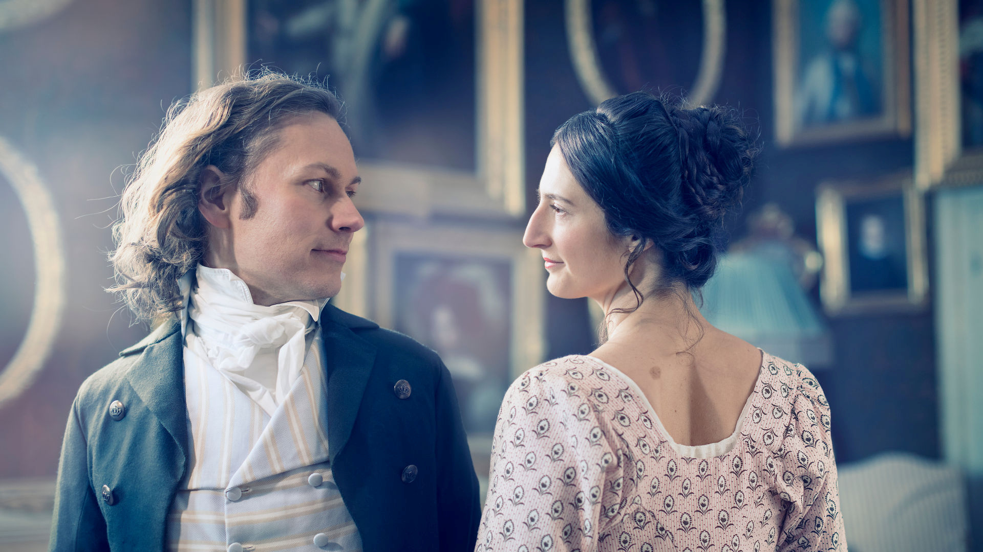 Two individuals in historical attire from a previous Jane Austen exhibition displayed at Skokloster Castle.