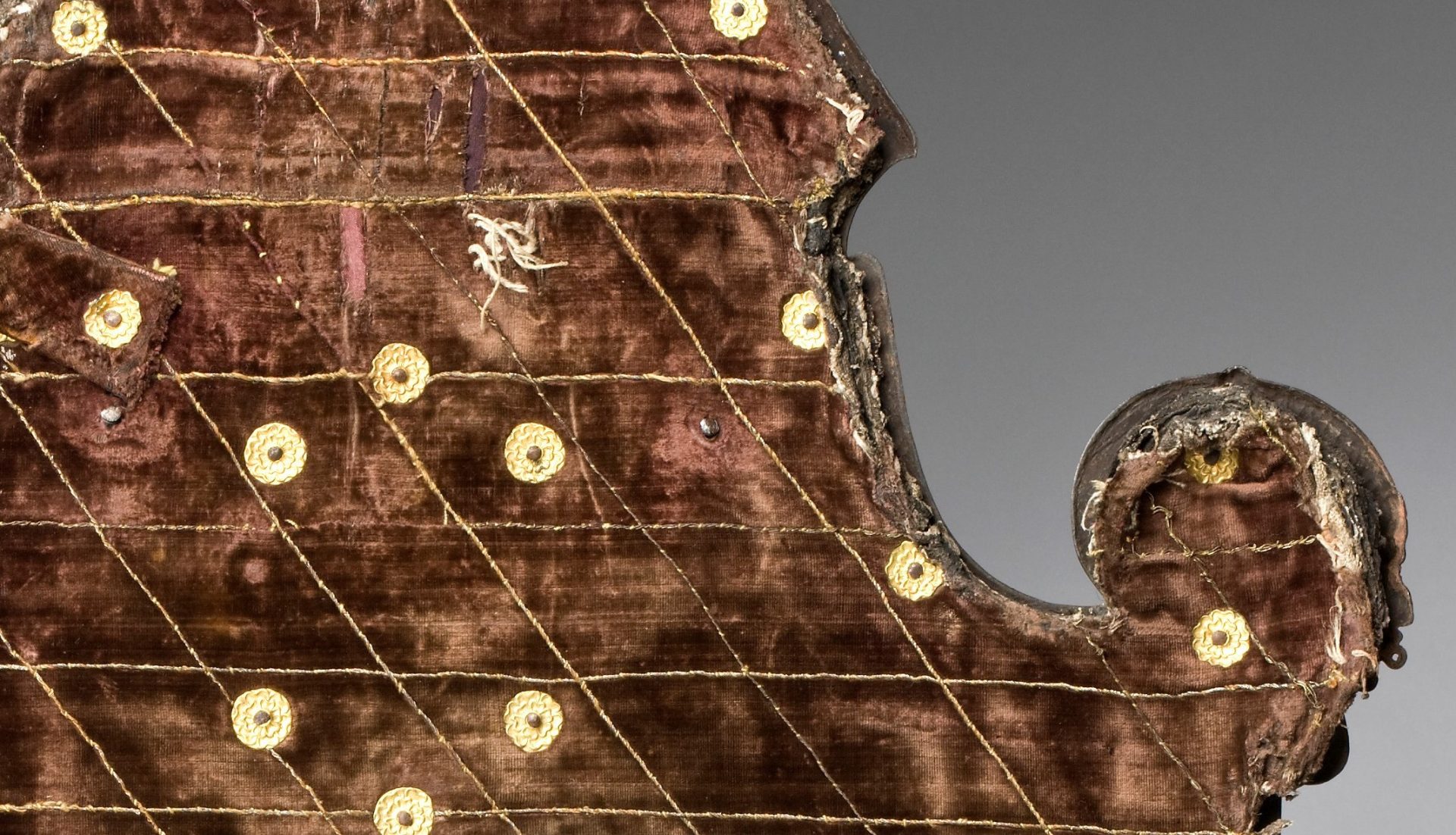 Detail of the back of the shield with its once red, now brown velvet. 