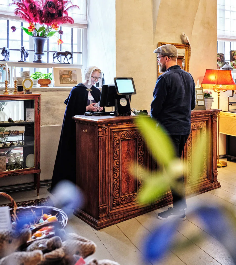 A visitor shopping in the castle shop.